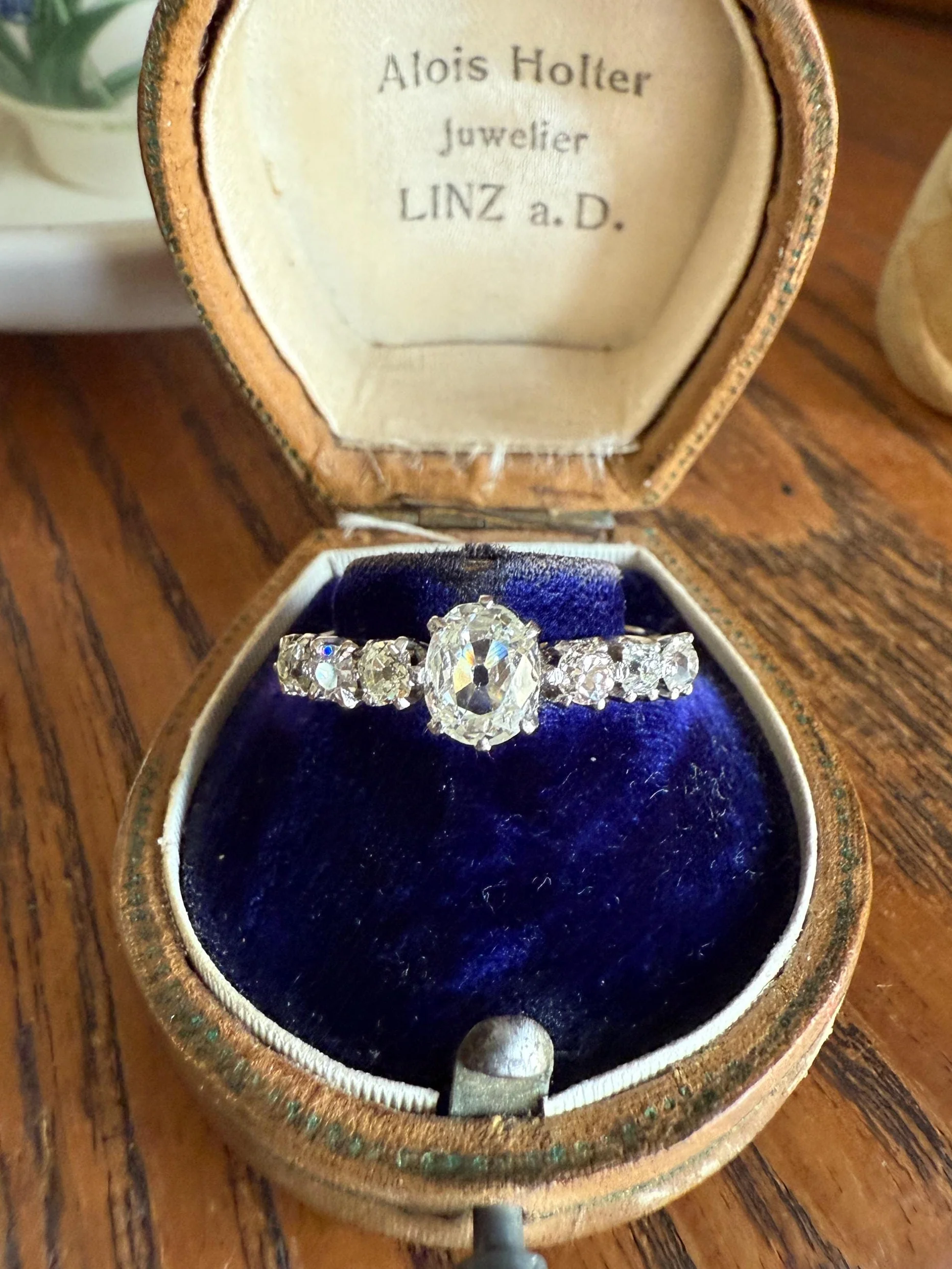 Antique Edwardian Art Deco 1.3 Carat Seven Stone Old Mine Cut Diamond Band Eye Clean Oval Center 18k Gold Platinum Prongs Tall Stacker